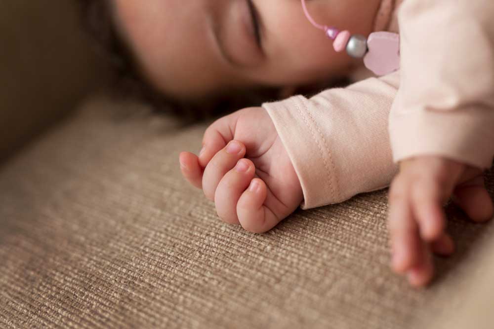 baby sleeping soundly in bed